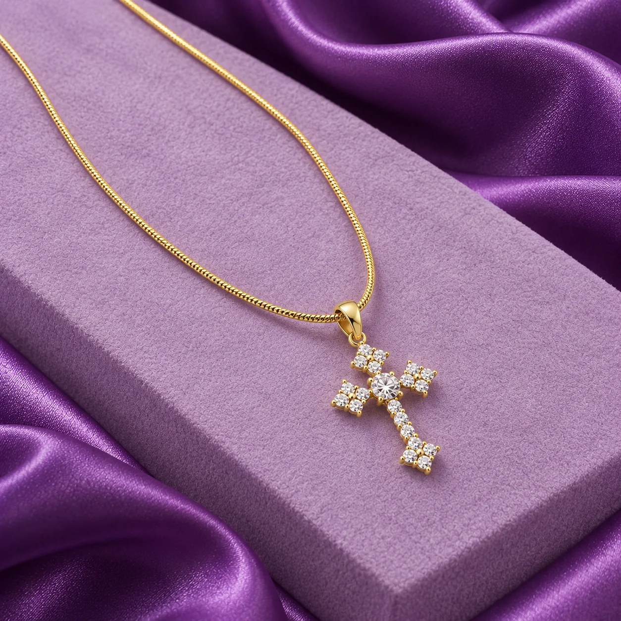 Cluster Ends Cross Necklace, angled flatlay on stand.