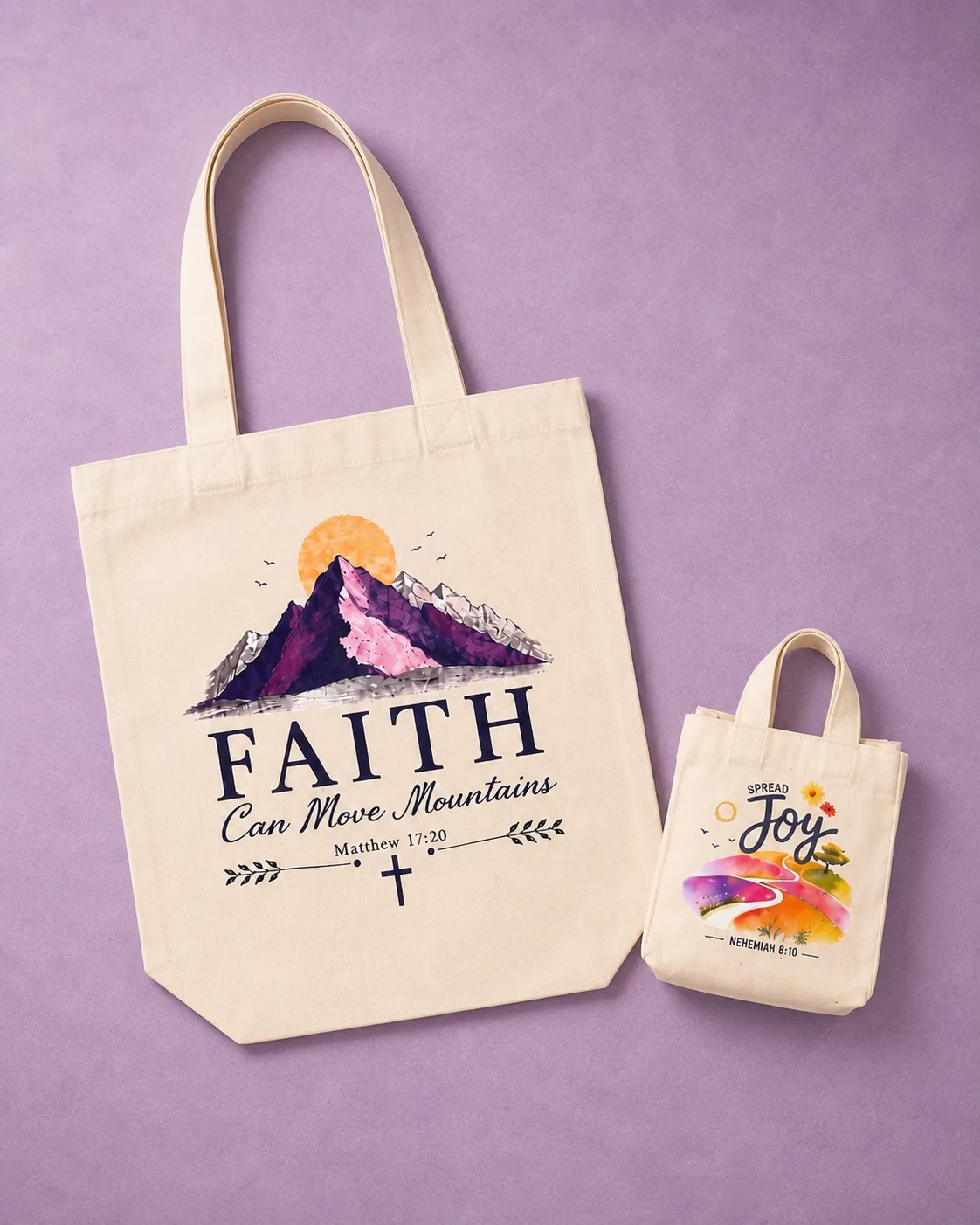 The Joy Duo shown together: one Faith Can Move Mountains Tote and one Spread Joy Mini Tote on a lavender surface.