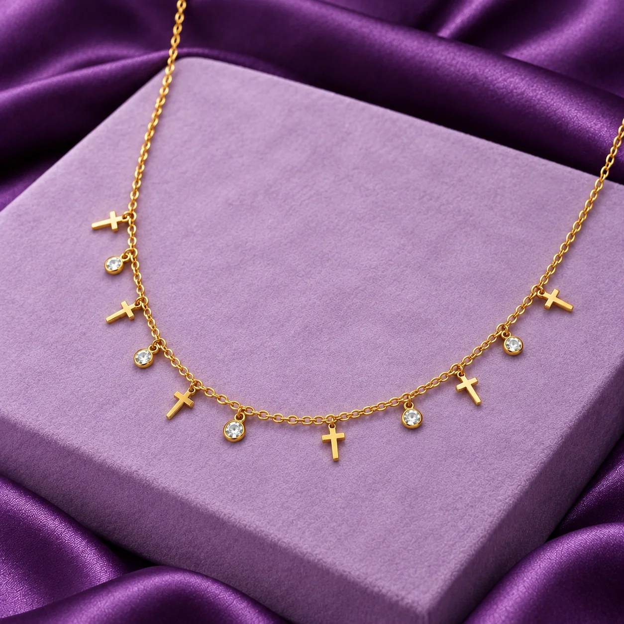 Multi Cross Charm Necklace, angled flatlay on stand.