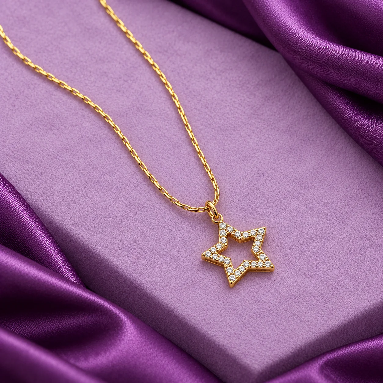 Star Pendant Necklace, angled flatlay on stand.